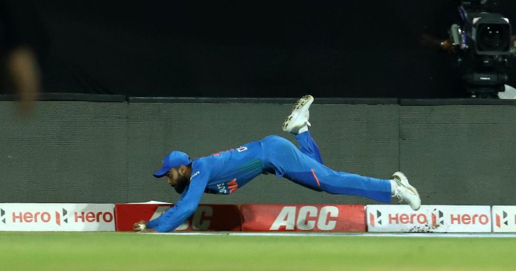 Kohli taking a sensational catch by the boundary